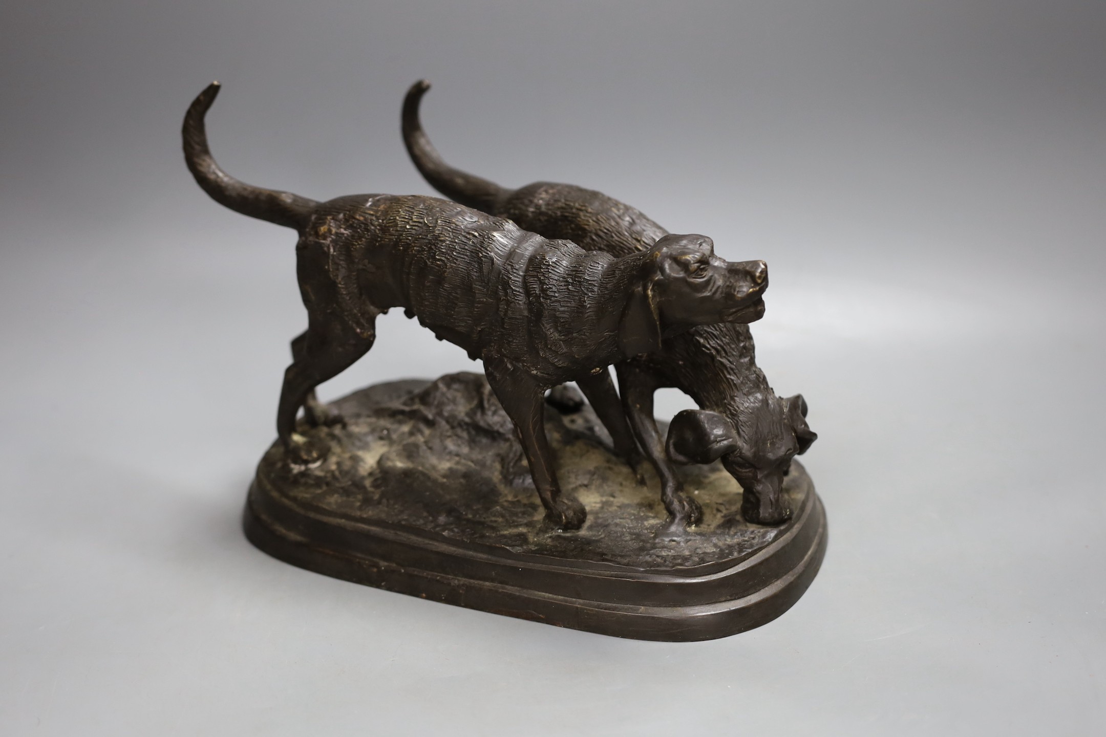 A bronze model of two hounds, 28cms wide